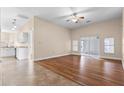 Spacious living room featuring hardwood floors and natural light sliding glass doors at 673 Leland Dr, Deltona, FL 32725