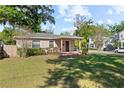 Beautiful home boasts a well-kept lawn, established landscaping, and a welcoming porch at 2320 Amherst Ave, Orlando, FL 32804