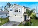 Charming two-story home with brick driveway, blue shutters, and well-maintained landscaping at 2724 Camden Ln, Davenport, FL 33837