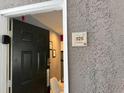 Condo entrance featuring a six-panel front door with a digital lock and unit number at 3100 Parkway Blvd # 325, Kissimmee, FL 34747