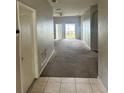 View of the living room with sliding doors leading to the backyard at 4406 Hidden Meadow Dr, Kissimmee, FL 34746