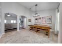 Bright dining room with a long wooden table and bench seating at 4740 Cypress Forest Ln, St Cloud, FL 34772