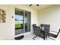 Outdoor patio with a dining set, a sliding glass door, and a view of the backyard at 486 Disa Dr, Davenport, FL 33837