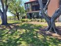 A view of the backyard showing mature trees providing plenty of shade at 133 La Casa # 133, Lake Wales, FL 33898
