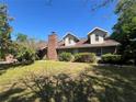 Charming two-story brick home with dormer windows and mature landscaping at 3725 Blossom St, Kissimmee, FL 34746