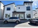 Contemporary townhouse showcasing a minimalist design, neutral colors, and ample parking spaces at 231 Villa Domani Cir # 59, Davenport, FL 33896