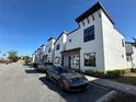 Row of modern townhouses with well-maintained landscaping, offering a stylish and comfortable living environment at 231 Villa Domani Cir # 59, Davenport, FL 33896