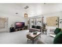 Bright living room featuring a neutral color palette, modern furnishings and lots of natural light at 3030 Little Sound Dr, Orlando, FL 32827
