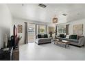 Bright living room featuring a neutral color palette, modern furnishings and lots of natural light at 3030 Little Sound Dr, Orlando, FL 32827