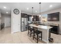 Modern kitchen with granite countertops, stainless steel appliances, and center island at 3675 Cabo Ln, St Cloud, FL 34772