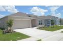 Charming single-story home with manicured lawn at 4881 Vellacito Way, Davenport, FL 33897