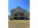 Two story exterior featuring double stairways, balconies, and neutral tone paint at 6148 Westgate Dr # 302, Orlando, FL 32835