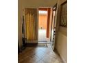 Welcoming tiled foyer featuring an open doorway leading to the backyard at 619 Tapatio Ln, Kissimmee, FL 34759