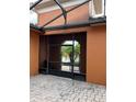 Screened patio that shows an outdoor living space, perfect for enjoying the weather at 619 Tapatio Ln, Kissimmee, FL 34759