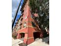 Exterior corner view of the multi-story building with street access and balconies at 911 N Orange Ave # 142, Orlando, FL 32801