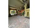 Inviting lobby area with fireplace, seating, and access to outdoor courtyard at 911 N Orange Ave # 142, Orlando, FL 32801