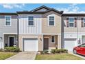 Charming townhomes with individual garages and manicured lawns at 916 Grandin St, Davenport, FL 33837