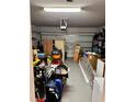 Spacious garage with ample storage, perfect for vehicles and projects at 2040 Milkweed St, Ocoee, FL 34761