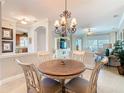 Open dining area with views of the living room and kitchen, bathed in natural light at 228 Sorrento Rd, Poinciana, FL 34759
