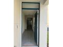 Inviting entryway featuring tile floors, neutral walls, and a view into the home's layout at 2755 Gentle Rain Dr, Davenport, FL 33837