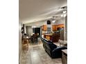 Inviting living room featuring an open floor plan and kitchen with granite countertops at 2917 Kokomo Loop, Haines City, FL 33844