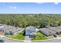 Aerial view of a well-manicured property, situated in a lush, green, and private neighborhood at 3010 Camden Way, Davenport, FL 33837