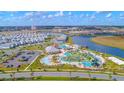 Stunning aerial view of community amenities including pools, water slides, and mini golf at 4835 Lullaby Ln, Kissimmee, FL 34746