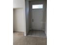Entryway showcasing tile flooring that transitions to neutral carpet, featuring a white door at 9061 Lee Vista Blvd # 1303, Orlando, FL 32829