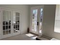 Bright living room featuring a glass-paned door leading to the outside at 10197 Ridgebloom Ave, Orlando, FL 32829