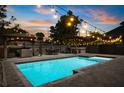 Beautiful backyard pool with string lights, outdoor seating, and a gazebo, perfect for entertaining at 2566 Conway Gardens Rd, Orlando, FL 32806