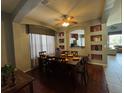Inviting dining room with dark wood furniture, decorative nooks, and lots of natural light at 2677 Emerald Island Blvd, Kissimmee, FL 34747