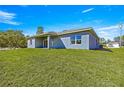A spacious backyard with lush green grass, offering plenty of room for outdoor activities and relaxation at 2700 Sw 162Nd St Rd, Ocala, FL 34473