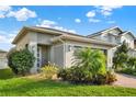 Well-maintained one-story house with green lawn and landscaping; front door is visible at 3005 Crispin Cir, Harmony, FL 34773