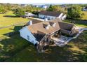 Scenic aerial view of a home with lush lawns, mature trees and detached garage at 3161 Appaloosa Ct, Kissimmee, FL 34746