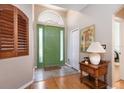 Inviting foyer with stylish tile flooring and a bright green front door at 4911 Lazy Oaks Way, St Cloud, FL 34771