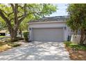 Spacious two-car garage with an extended driveway, providing ample parking at 4911 Lazy Oaks Way, St Cloud, FL 34771