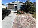 Charming home featuring vinyl siding, and a paved driveway and patio for outdoor gatherings at 50989 Highway 27 # 210, Davenport, FL 33897
