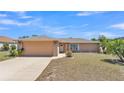 Charming one-story home with a well-maintained lawn and a two-car garage at 6056 Hillside Heights Dr, Lakeland, FL 33812