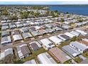 Aerial view showcasing the property's location within a vibrant community near a lake at 6711 Canterbury Ne Dr, Winter Haven, FL 33881