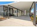 Spacious carport offering ample covered parking and access to the home's entrance at 6711 Canterbury Ne Dr, Winter Haven, FL 33881
