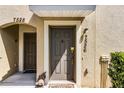 Inviting front door with a welcome mat and visible unit number, creating a sense of arrival at 7526 Pellham Way, Kissimmee, FL 34747