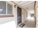 Inviting front door entrance features a secure screen door and a welcome mat for a warm greeting at 845 Orchid Springs Dr, Winter Haven, FL 33884