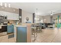 Open concept layout with kitchen, dining, and living area at 8534 Crystal Cove Loop, Kissimmee, FL 34747