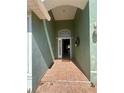 Inviting entryway showcasing a tile floor, arched ceiling, and a glimpse of the interior at 1149 E Grove Ave, Lake Wales, FL 33853