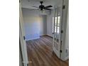 Bedroom featuring beautiful flooring, a ceiling fan, and a glass door leading outside at 2031 Dixie Belle Dr # Q, Orlando, FL 32812