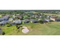 Golf course community featuring lovely homes and verdant landscaping at 213 Strathmore Cir, Kissimmee, FL 34744