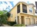 Inviting two-story home features a private screened balcony and an attached one car garage at 2787 Oakwater Dr # 149, Kissimmee, FL 34747