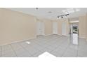 Bright living room with tile flooring, neutral walls, and multiple storage closets at 31 Las Palmas Way, Kissimmee, FL 34743