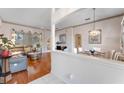 Elegant living and dining areas featuring hardwood floors and neutral decor at 310 N Hampton Dr, Davenport, FL 33897