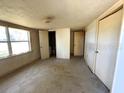 Bedroom with multiple closets and a window for natural light at 4226 Lake Richmond Dr, Orlando, FL 32811